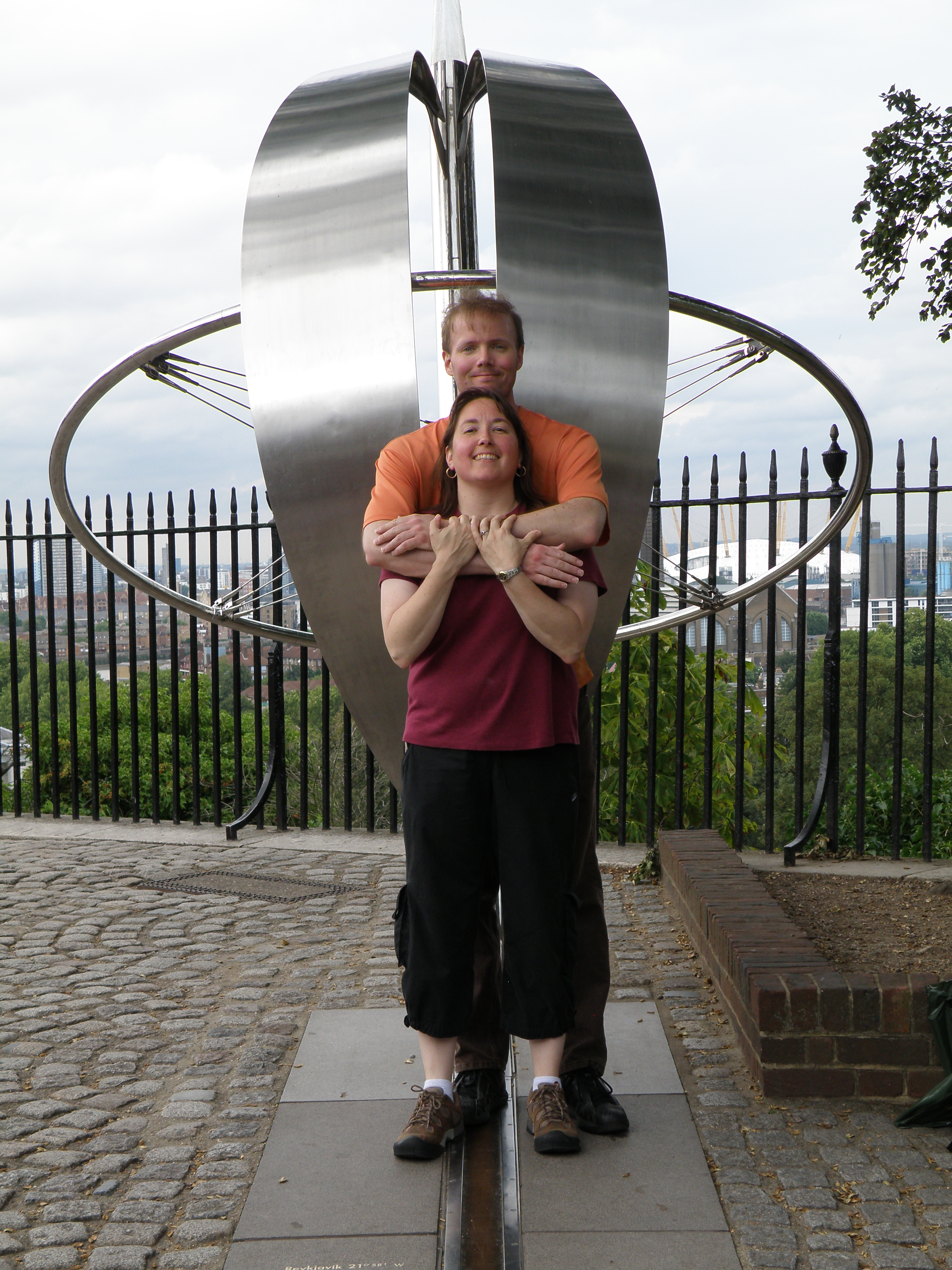 Image of Esther and Scott Rhatigan standing in front of statue on exhibit at the Royal Observatory in 2009